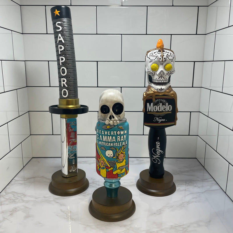 Three bespoke resin tap handles